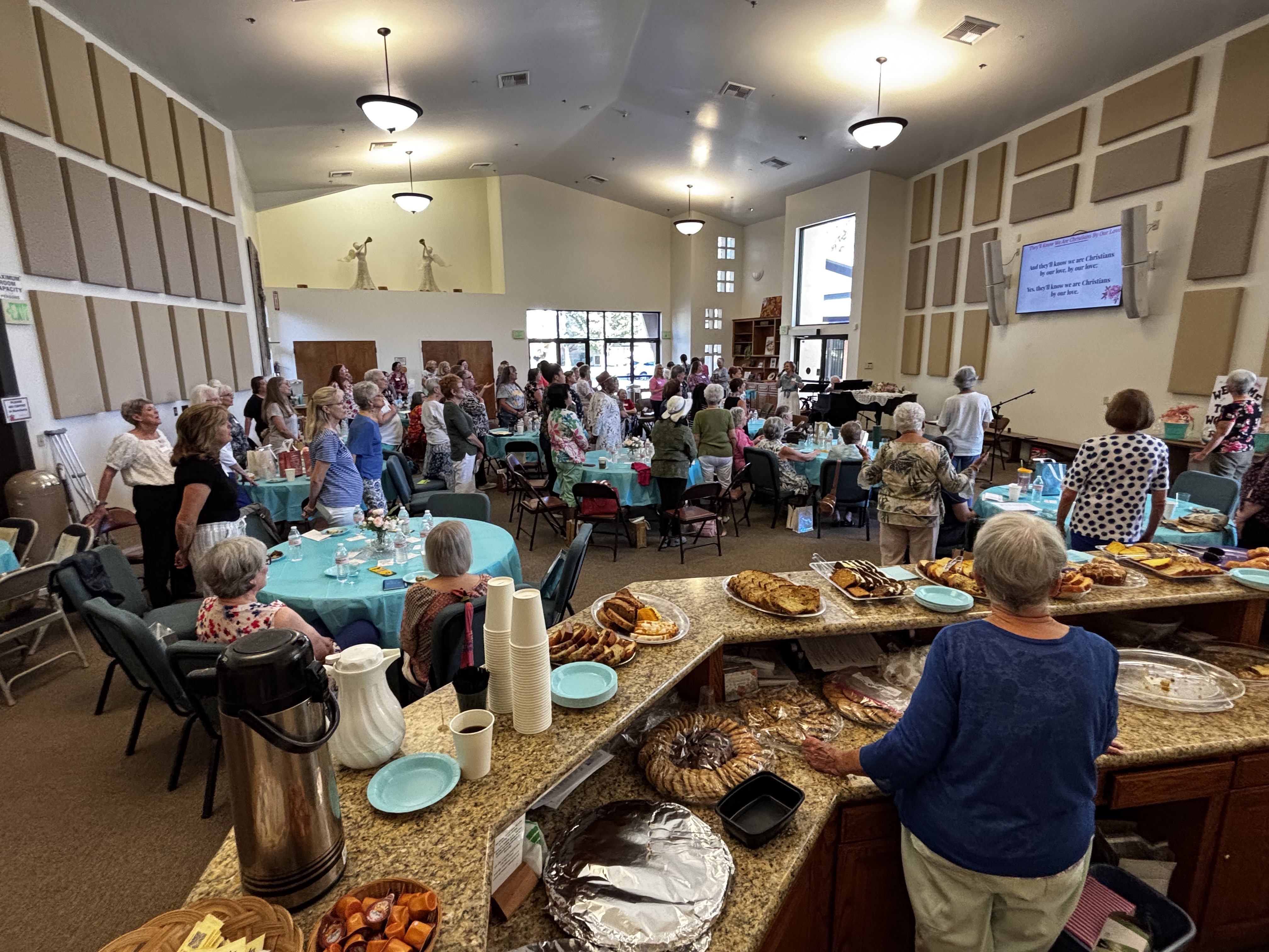 Worship center filled with women's retreat participants
