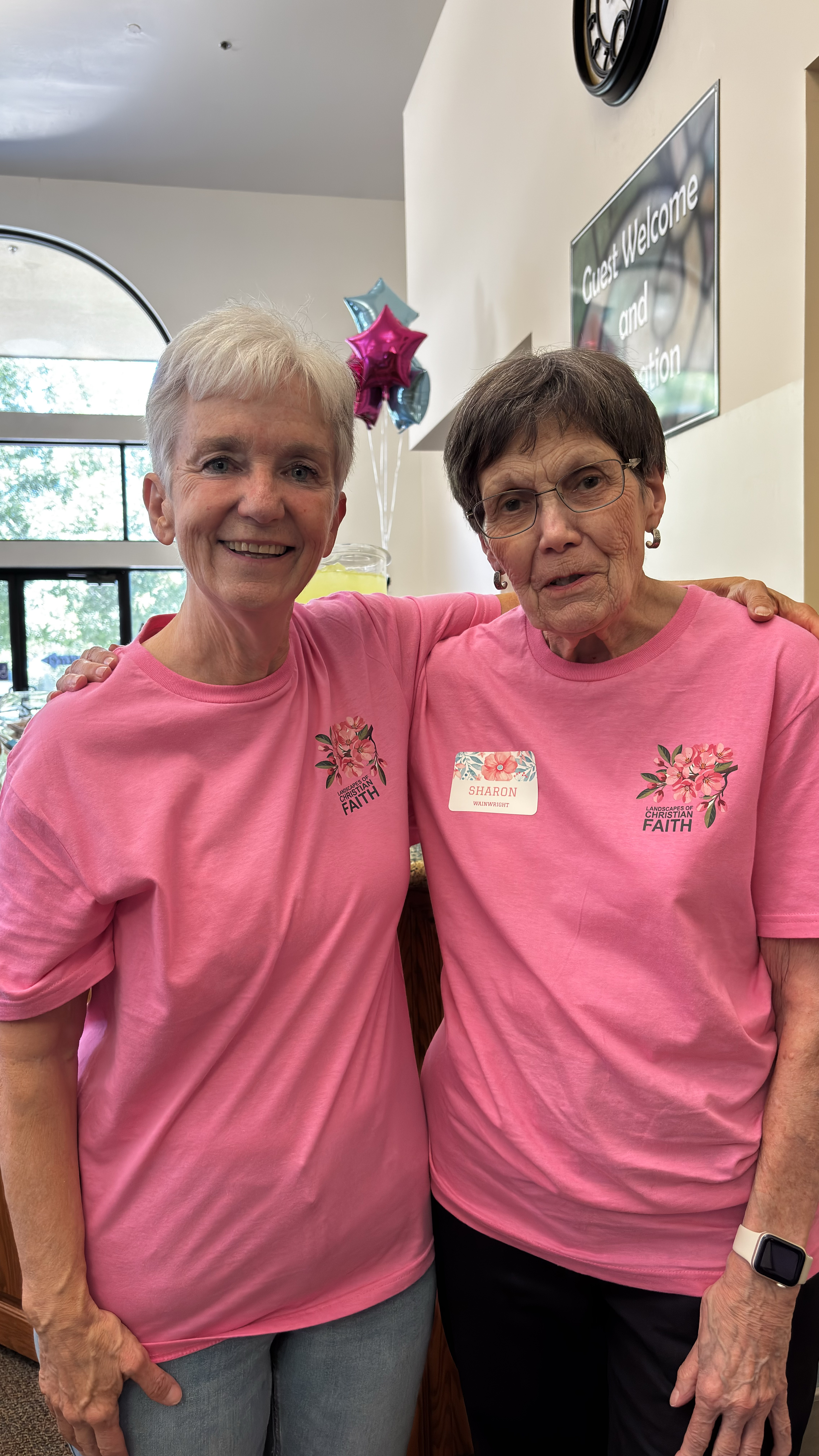 Dedicated volunteers in matching Faith t-shirts